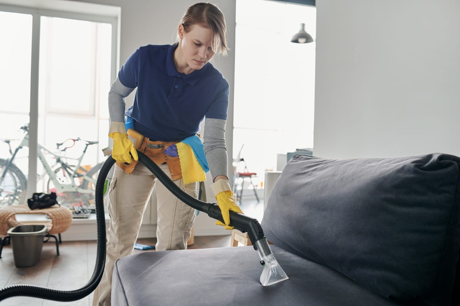 Magic Broom cleaner deep cleaning a sofa in a Sydney apartment