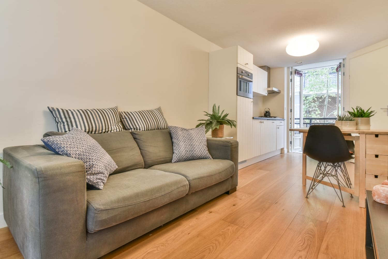 Tidy apartment lounge and kitchen after a turnover clean